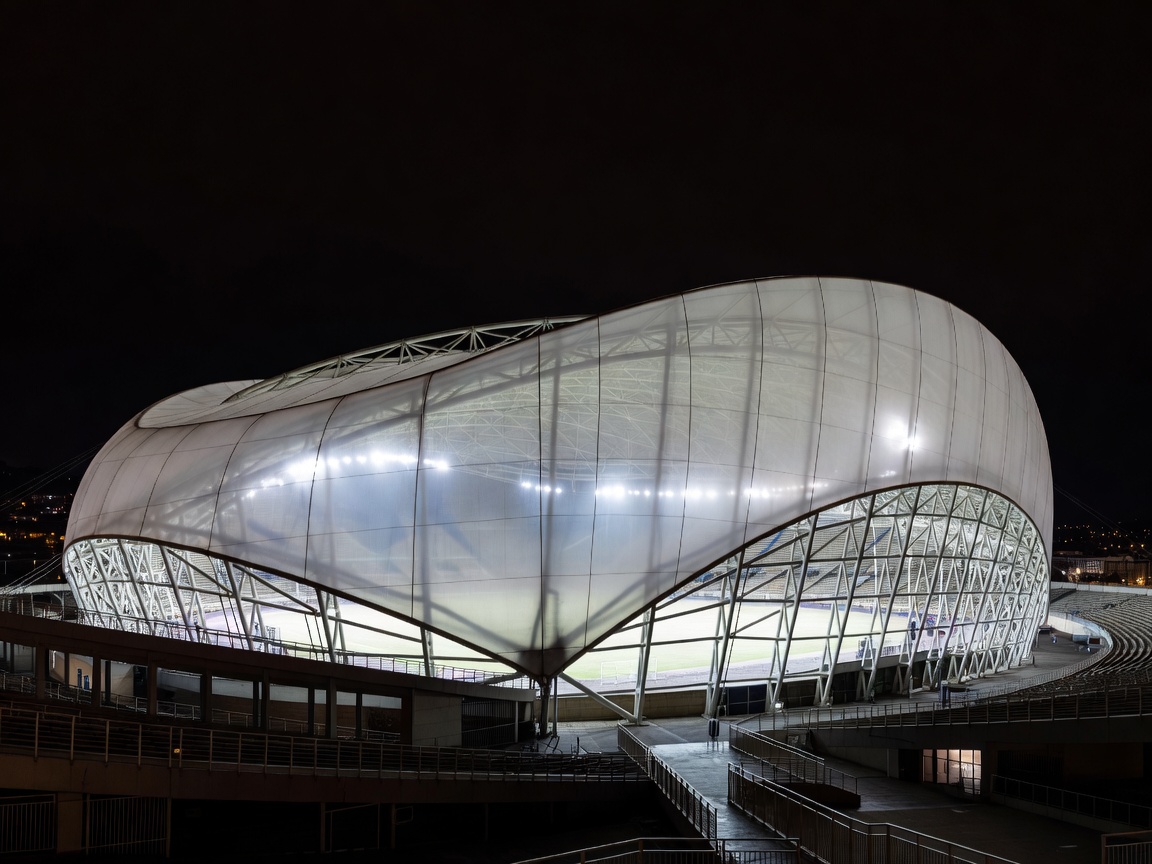 Marseille Orange Velodrome translucent stadium canopy at night